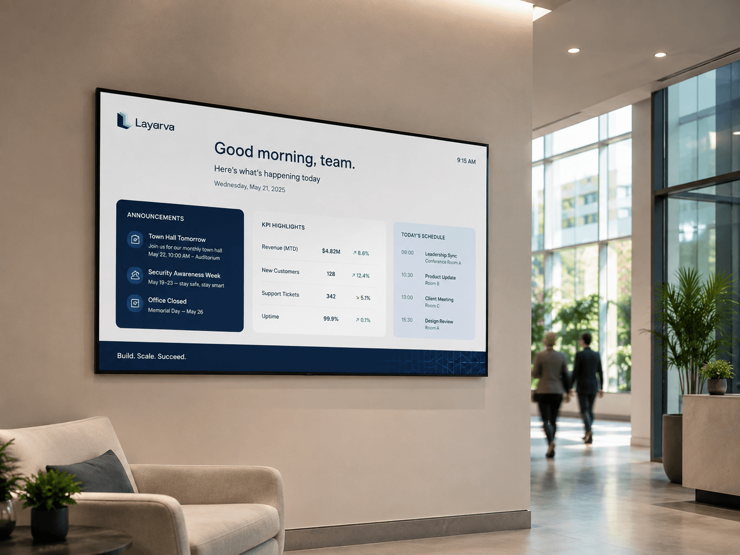 Corporate lobby screen showing team announcements and performance figures