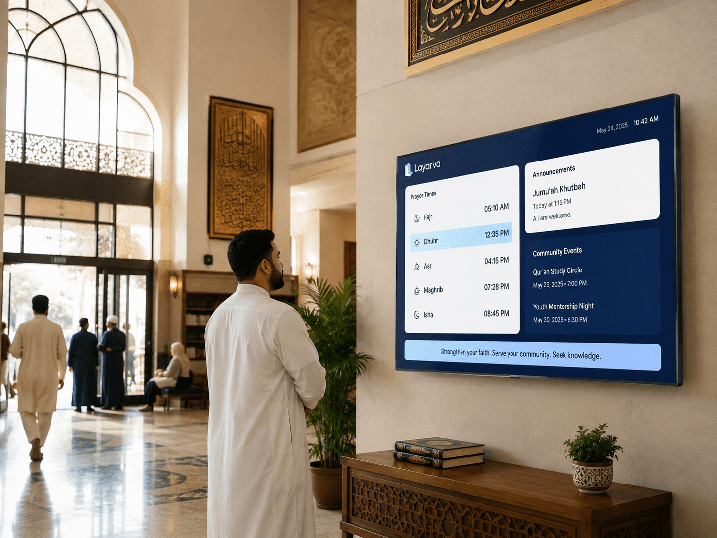 Prayer hall display showing prayer times and community announcements