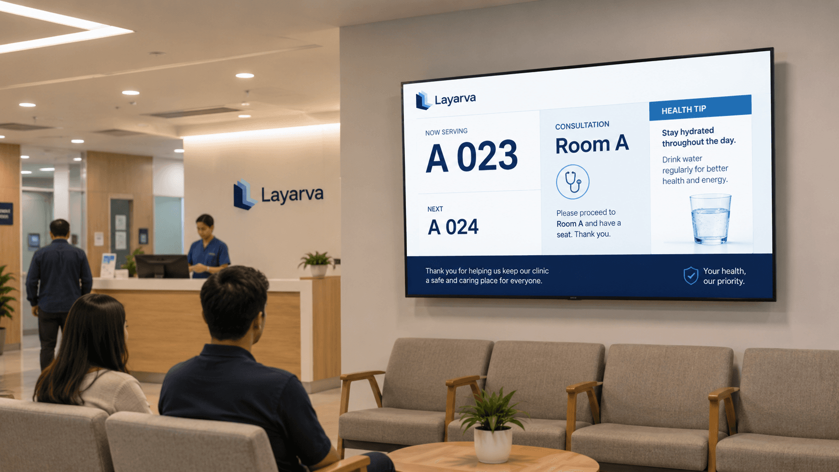 A clinic waiting area with a display showing queue information